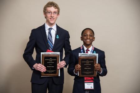 Award winning students pose with plaques